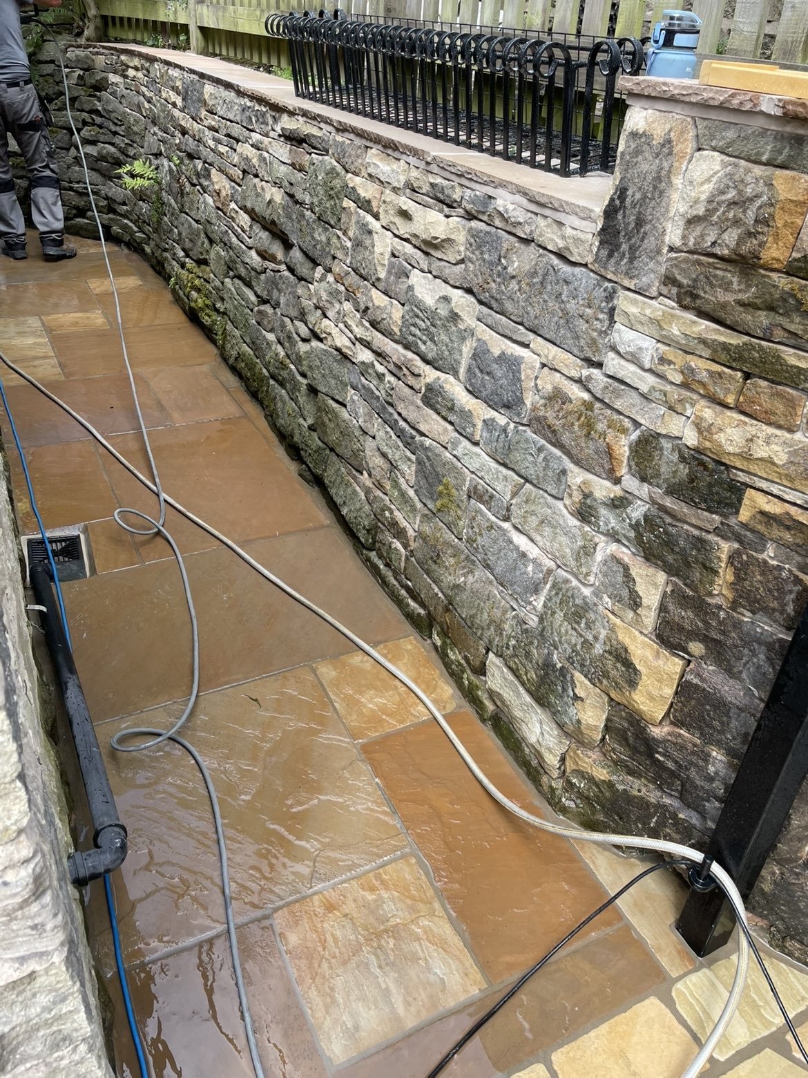 Sett paving with new stone retaining wall