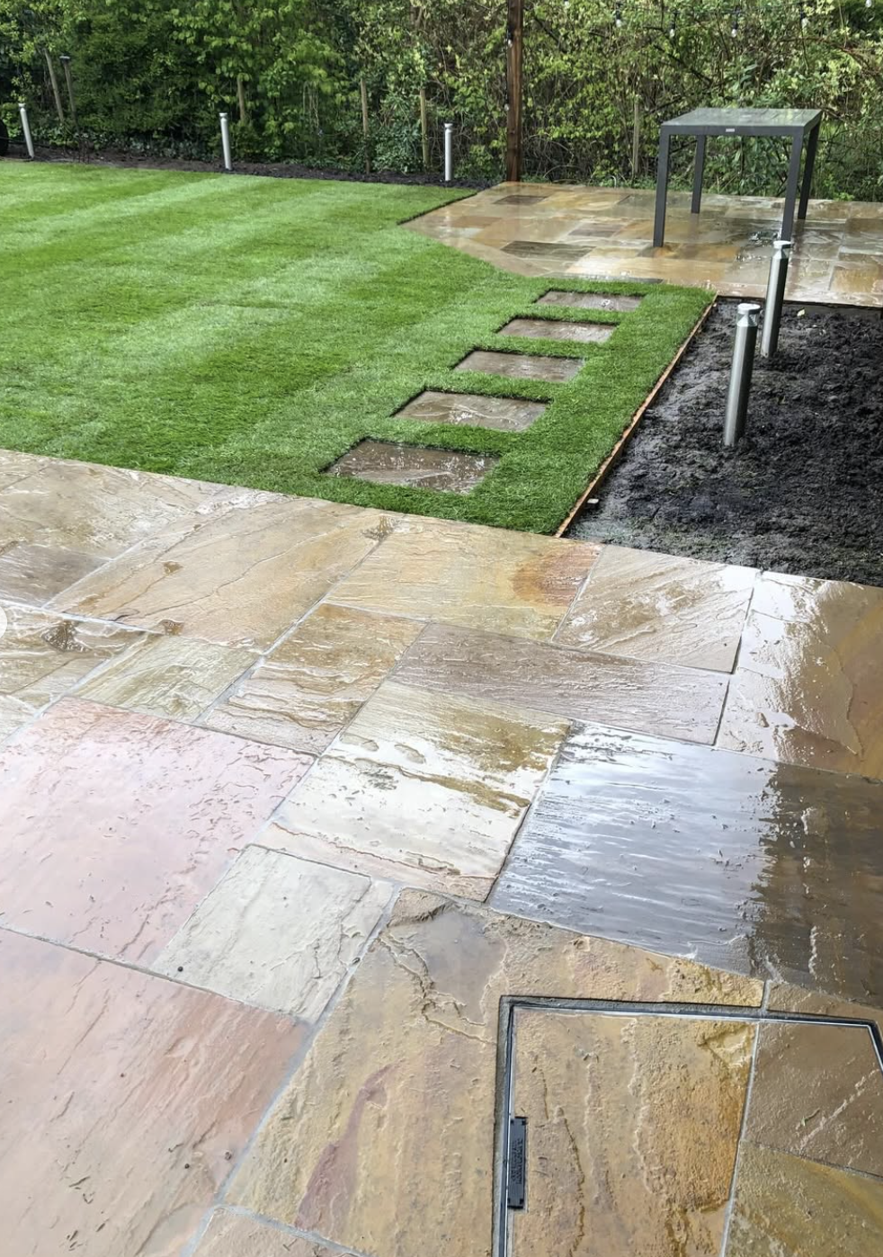 Patio with lawn and stepping stones