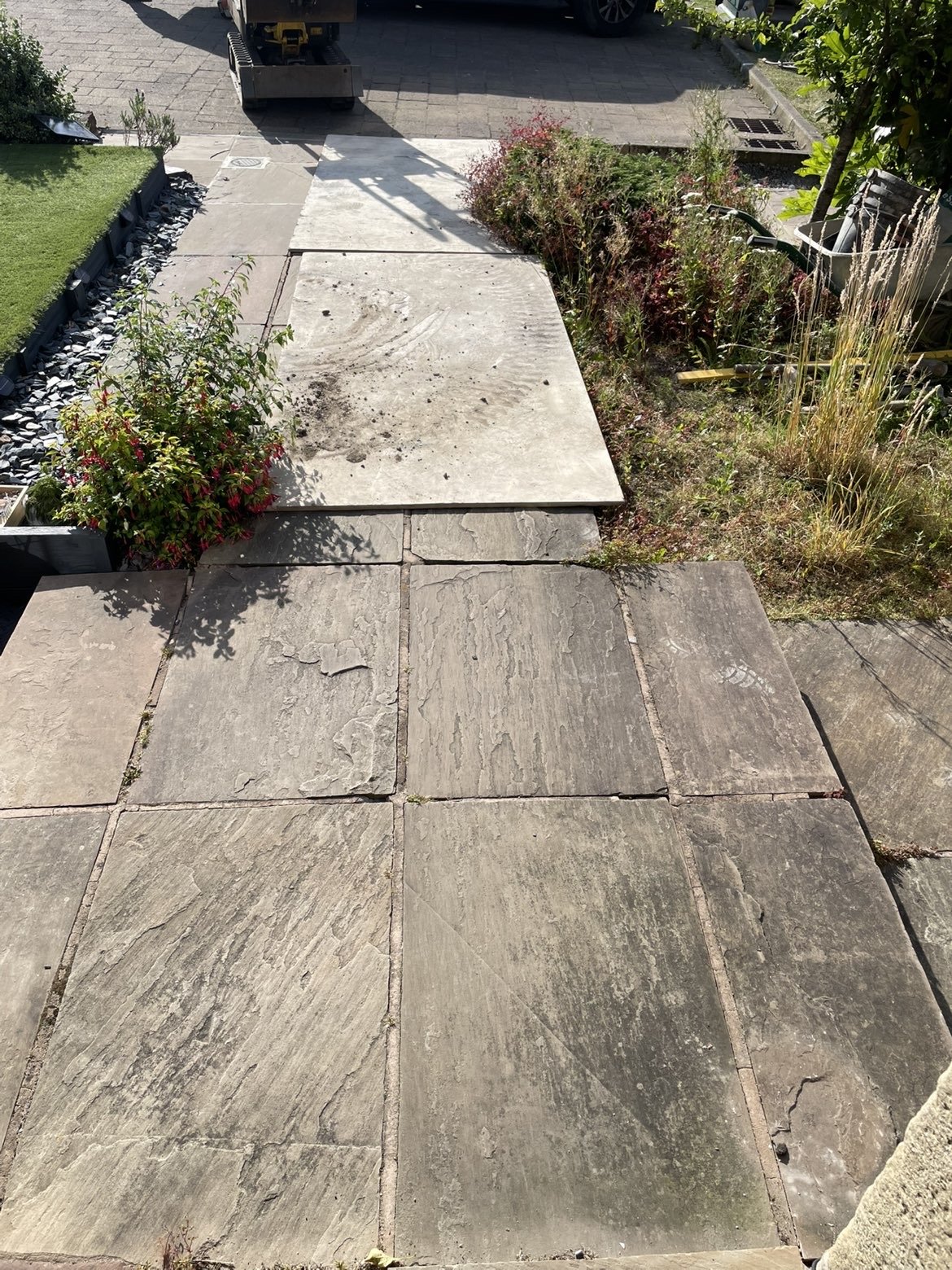 Sandstone patio being laid during construction